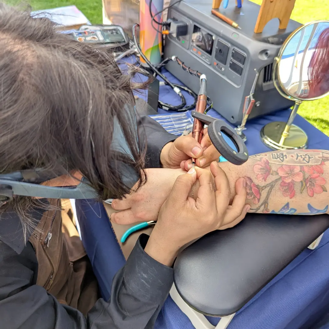 A Starmarked artist welding a custom-fit bracelet