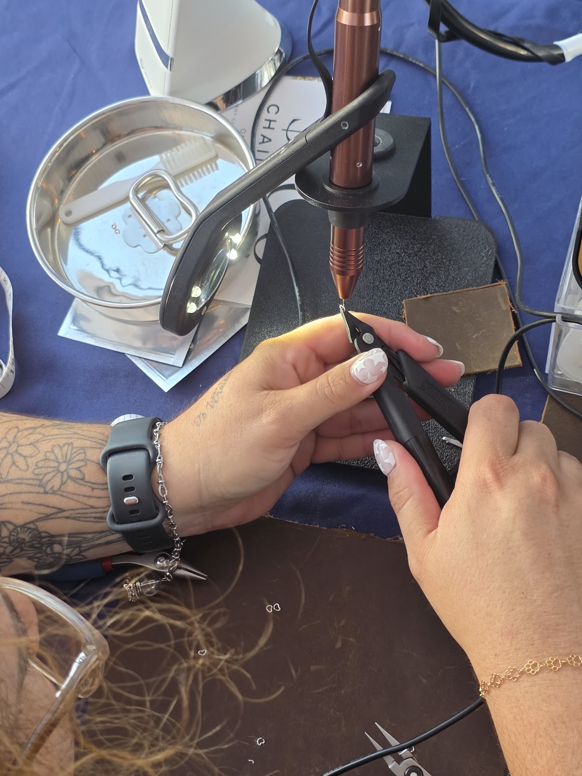 A close-up of permanent jewelry craftsmanship at Starmarked