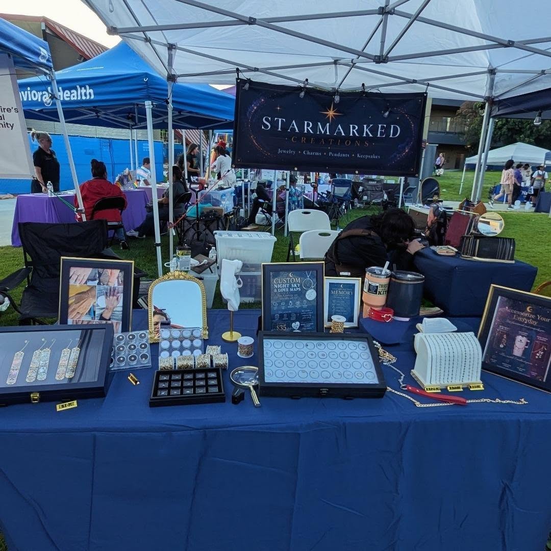 Starmarked jewelry booth with chain and charm displays